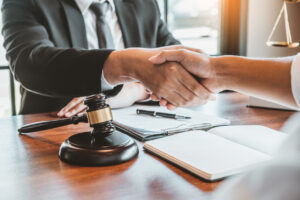 Lawyer Shaking an Immigration Client's Hands