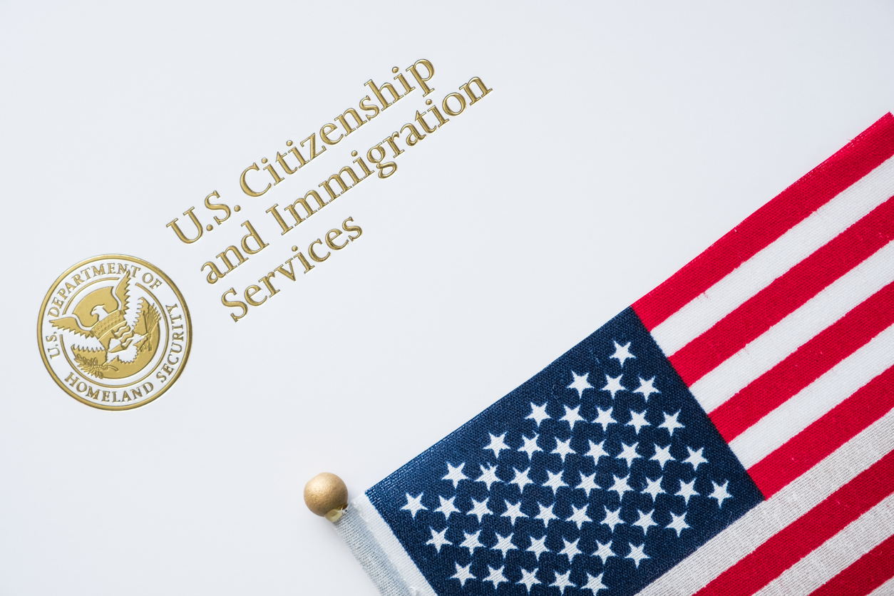 temporary work visa USCIS envelope with american flag